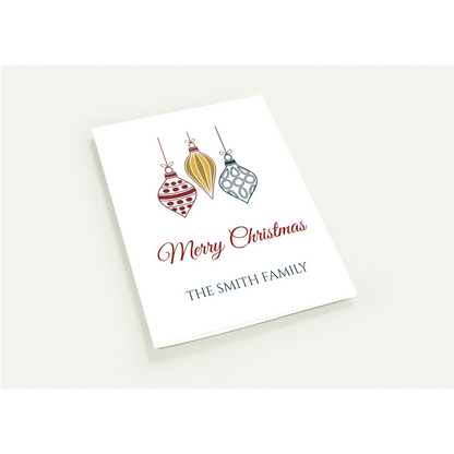 Personalized family name Christmas card with red, gold and navy ornaments and Merry Christmas script