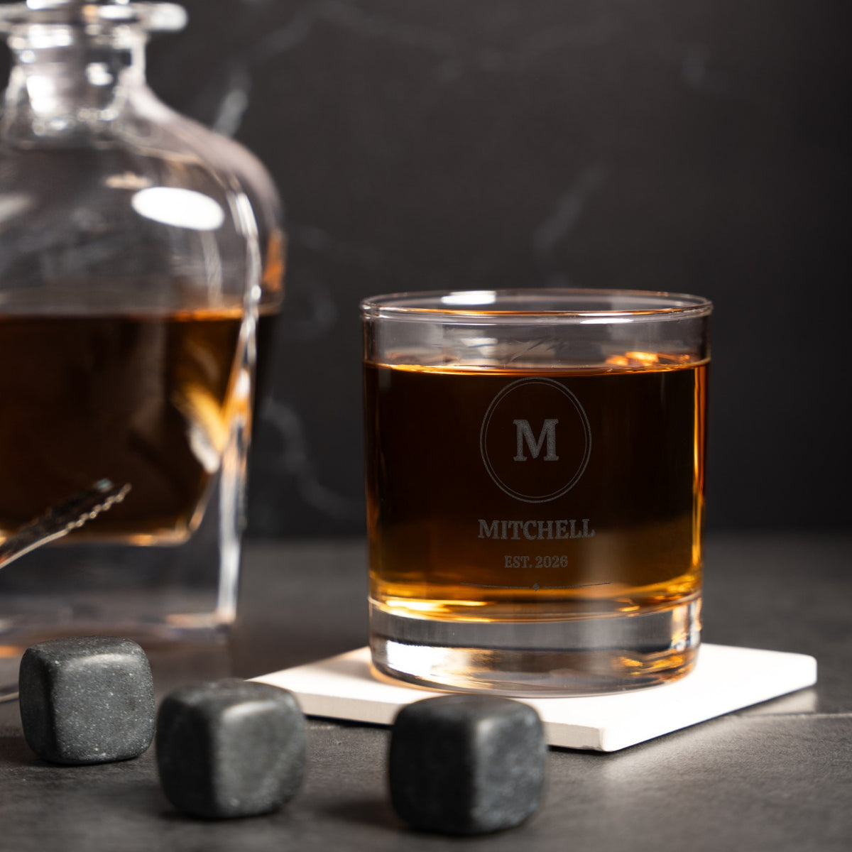 Close-up of the etched circle monogram and name on the whiskey glass