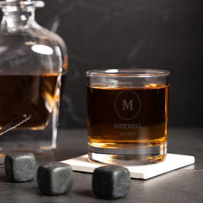 Close-up of the etched circle monogram and name on the whiskey glass