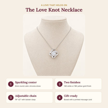 Love Knot necklace features: 6mm cubic zirconia, 14K white or 18K yellow gold finish, adjustable 18-22 inch chain, boxed with a message card